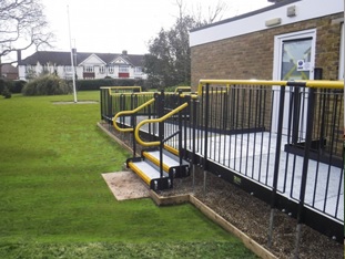yellow handrail on ramp 